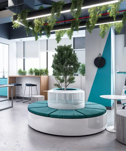 Modern office space featuring a circular seating area with teal cushions and a central potted tree. Above, there is a hanging light fixture adorned with greenery. The room includes a high table with stools, large windows, and minimalist decor with teal accents.